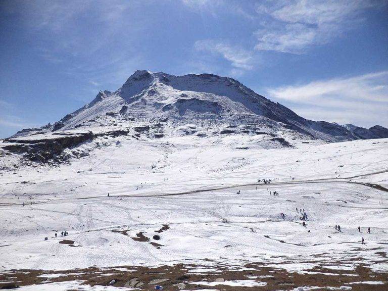 Snow covered Rohatang Pass under bright sunlight